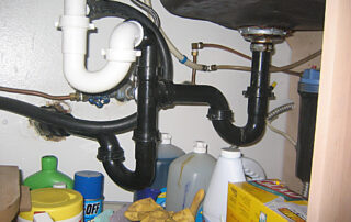 In plumbing, a trap is a U-shaped portion of pipe designed to trap liquid or gas to prevent unwanted flow; most notably sewer gases from entering buildings while allowing waste materials to pass through. AMI sample photo from a home inspection