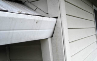 Poor gutter installation - AMI sample photo from a home inspection